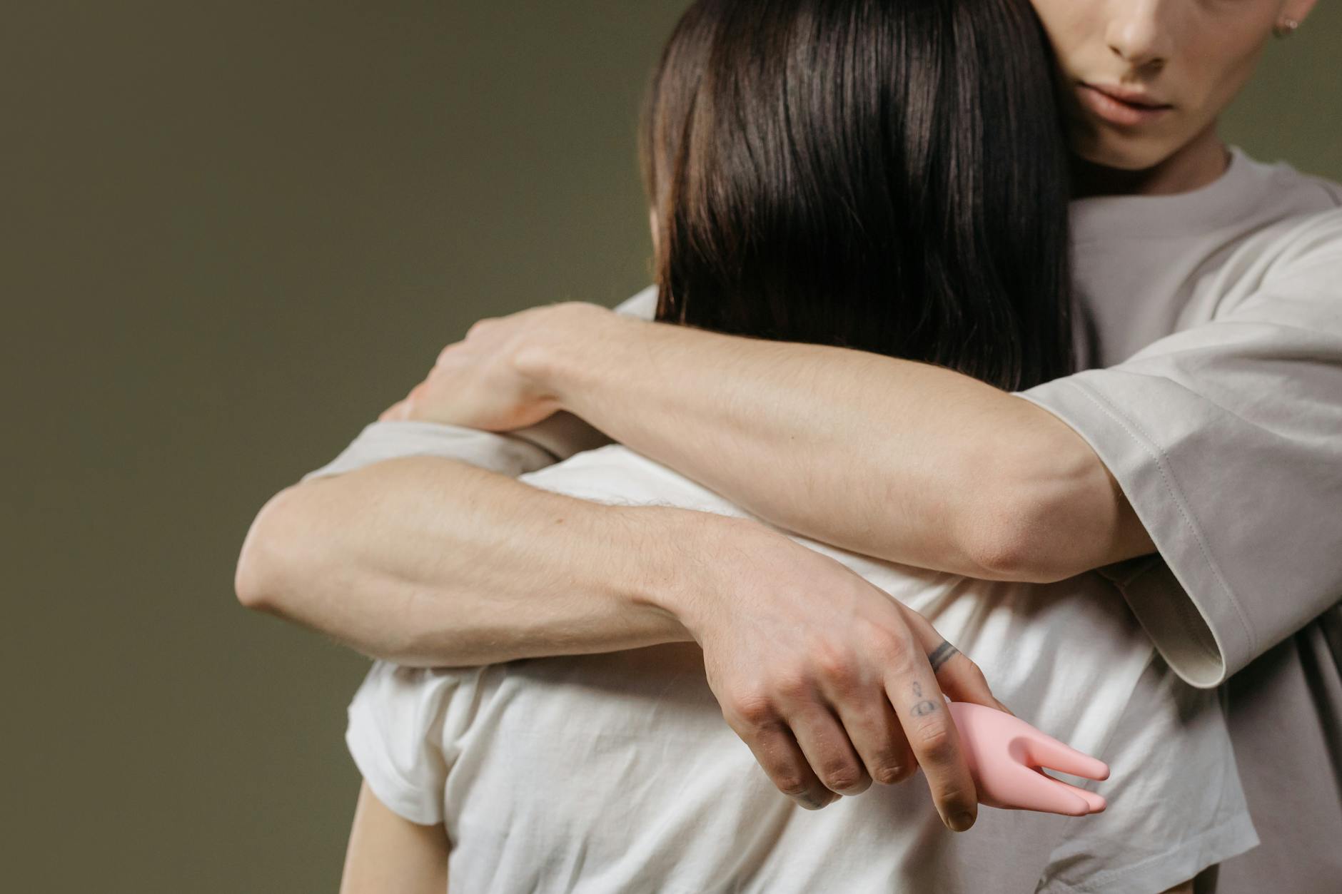 Close-up of a couple embracing, highlighting the emotional intimacy that comes before physical desire.